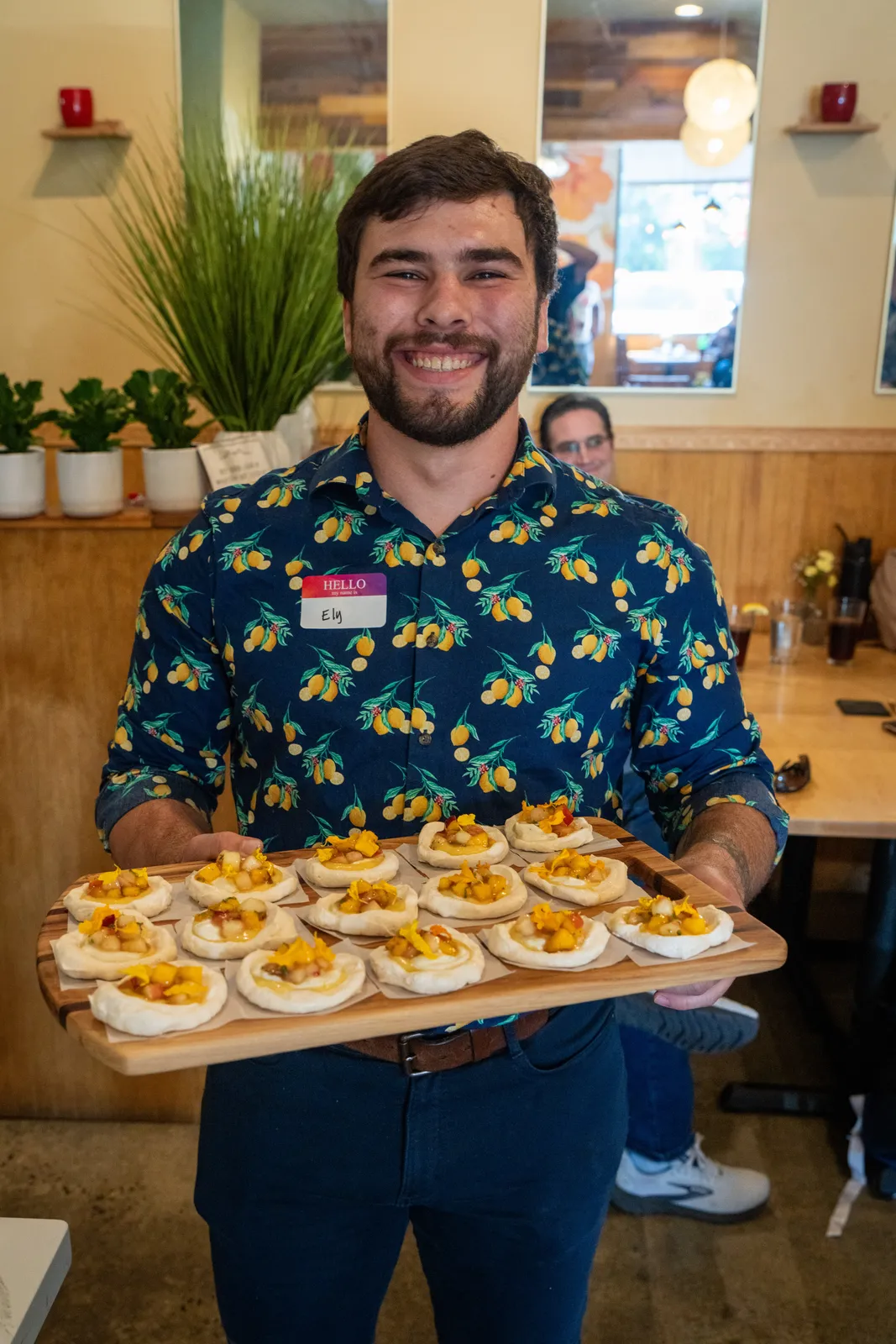 A baker presents his creation
