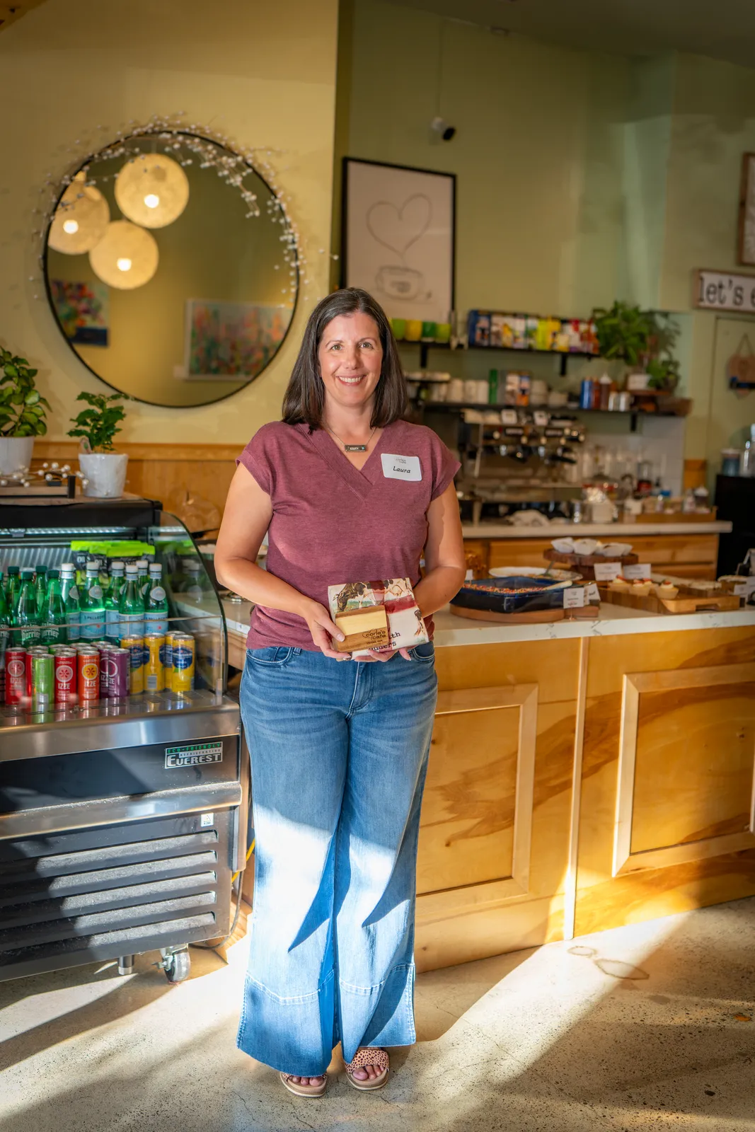 A baker with her tray of treats
