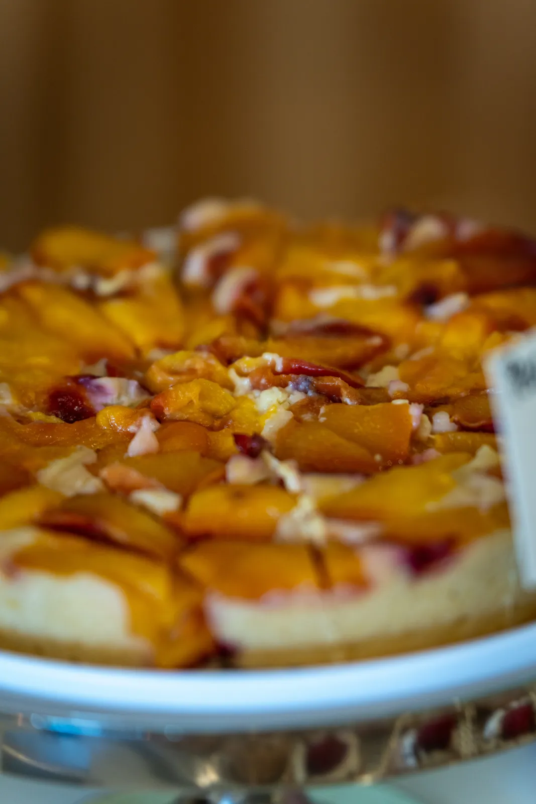 A peach-topped cheesecake tart